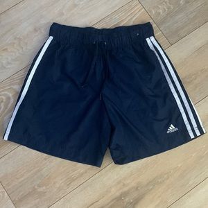 Navy blue adidas shorts with white stripes